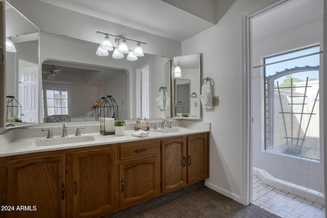 bathroom with ceiling fan and vanity