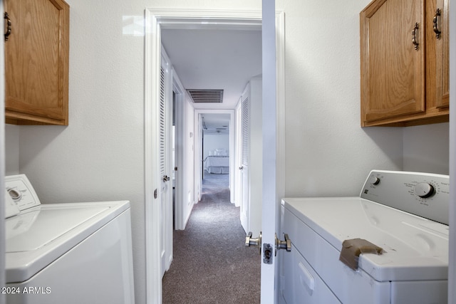 washroom with carpet, cabinets, and independent washer and dryer