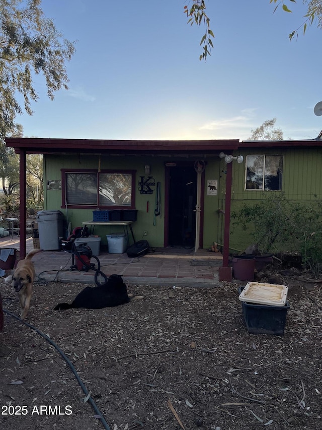 view of front facade with a patio area