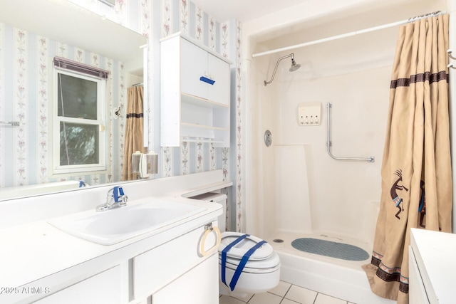 bathroom featuring vanity, toilet, tile patterned floors, and walk in shower