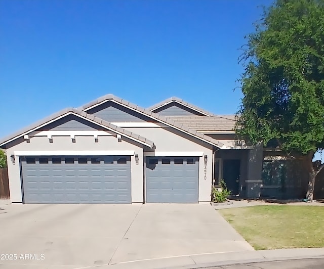 34970 N Spur Cir, San Tan Valley, AZ 85144 - ranch-style home featuring a tile roof, concrete driveway, a garage, and stucco siding