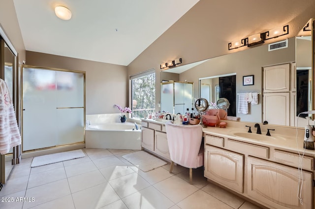 bathroom with vanity, vaulted ceiling, tile patterned floors, and shower with separate bathtub