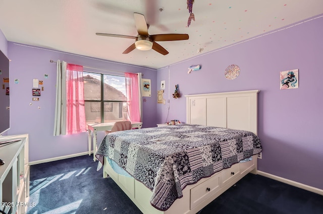 bedroom with ceiling fan and dark carpet