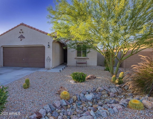 1654 E Jardin Pl, Casa Grande, AZ 85122 - mediterranean / spanish house with an attached garage, concrete driveway, stucco siding, and a tile roof