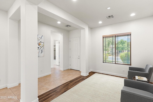 sitting room with recessed lighting, wood finished floors, and baseboards