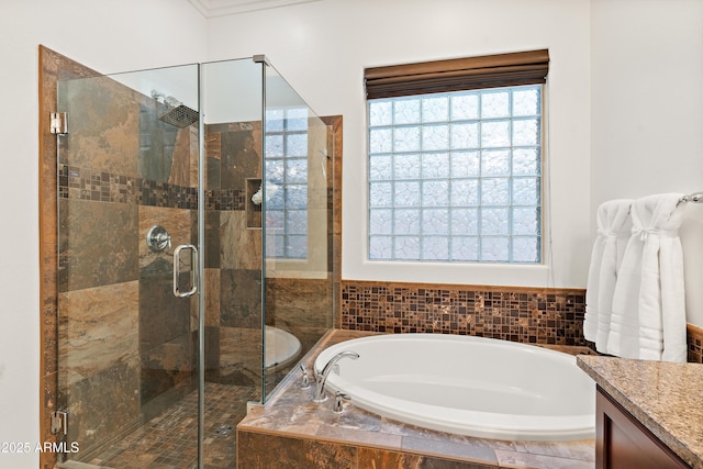 full bath featuring a garden tub, a stall shower, vanity, and ornamental molding