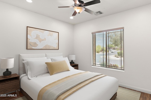 bedroom featuring baseboards, recessed lighting, wood finished floors, and a ceiling fan