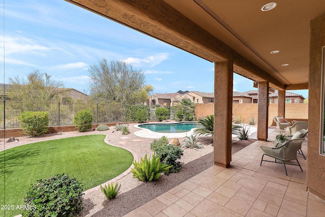 view of swimming pool featuring a patio area