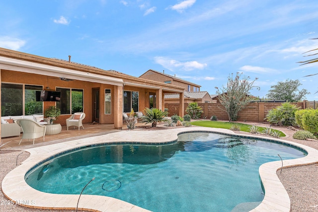 view of pool with a fenced backyard, ceiling fan, and a patio area