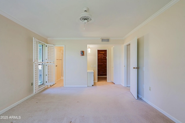 unfurnished bedroom featuring light colored carpet, a closet, a spacious closet, and ornamental molding