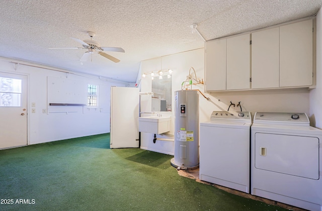 laundry area with washing machine and clothes dryer, ceiling fan, a textured ceiling, and water heater