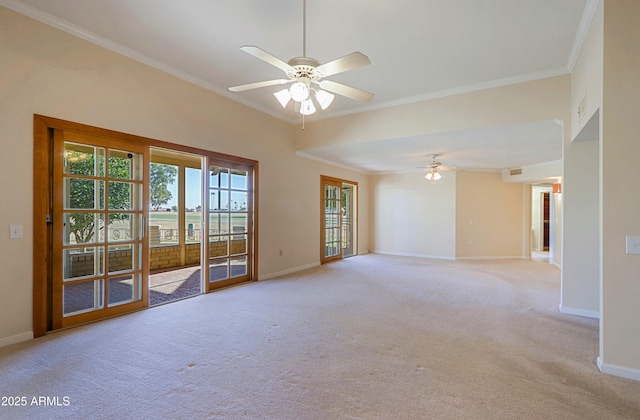 carpeted spare room with ceiling fan and crown molding