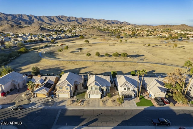 birds eye view of property featuring a mountain view