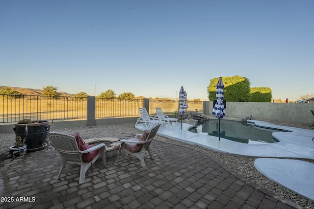 view of patio featuring a fenced in pool