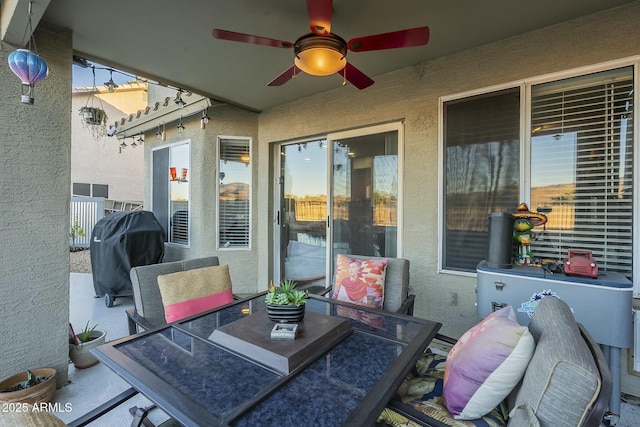 view of patio / terrace with ceiling fan and a grill