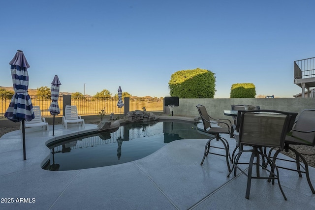 view of swimming pool with a patio