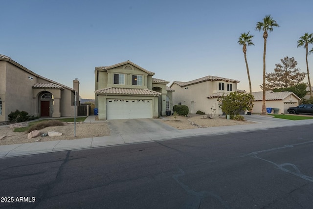 mediterranean / spanish-style home with a garage