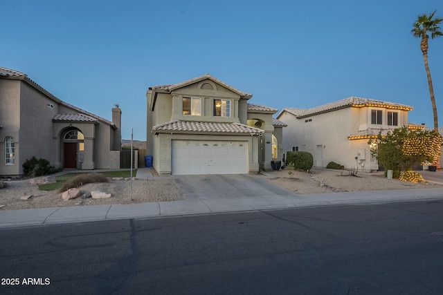 mediterranean / spanish-style home with a garage