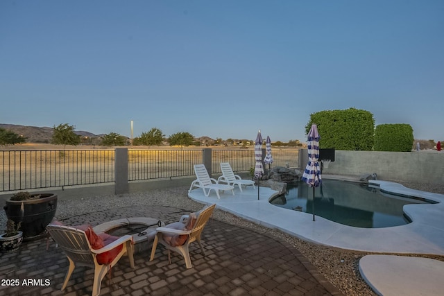 view of patio featuring a fenced in pool