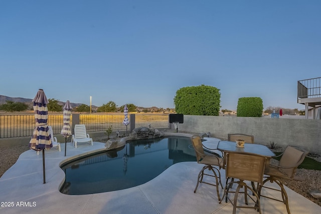 view of swimming pool with a patio area