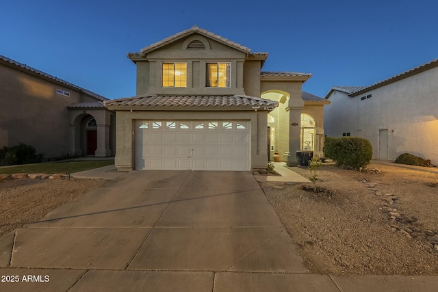 mediterranean / spanish-style home featuring a garage