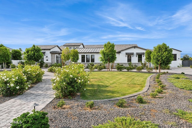 4024 E Minton Cir, Mesa, AZ 85215 - view of front facade featuring stucco siding, a front lawn, and a standing seam roof