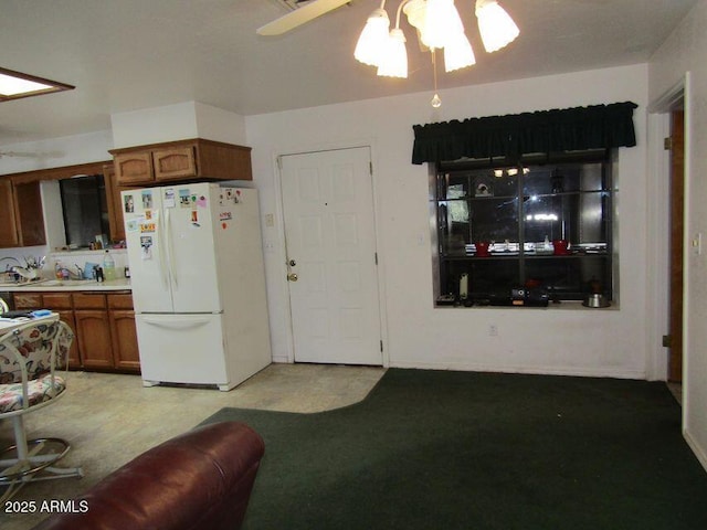 kitchen with white refrigerator and ceiling fan