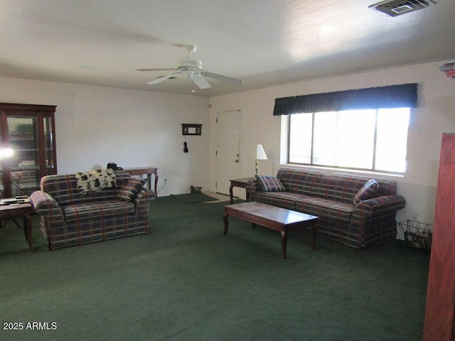 living room with ceiling fan and carpet floors