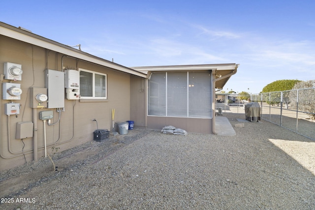 view of side of property with a patio