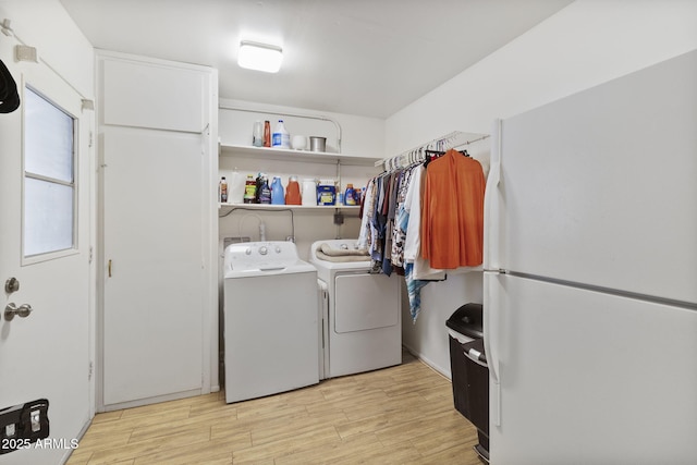 clothes washing area featuring washer and dryer