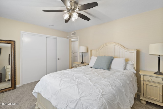 bedroom with light carpet, a closet, and ceiling fan