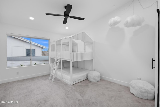 carpeted bedroom featuring ceiling fan