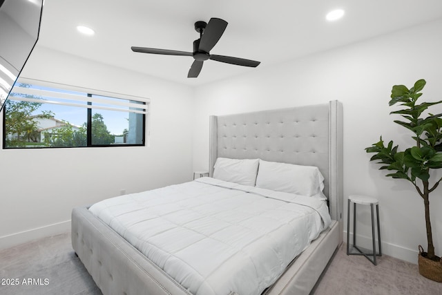 bedroom featuring light colored carpet and ceiling fan