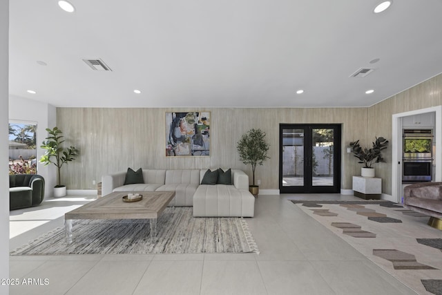 tiled living room featuring french doors