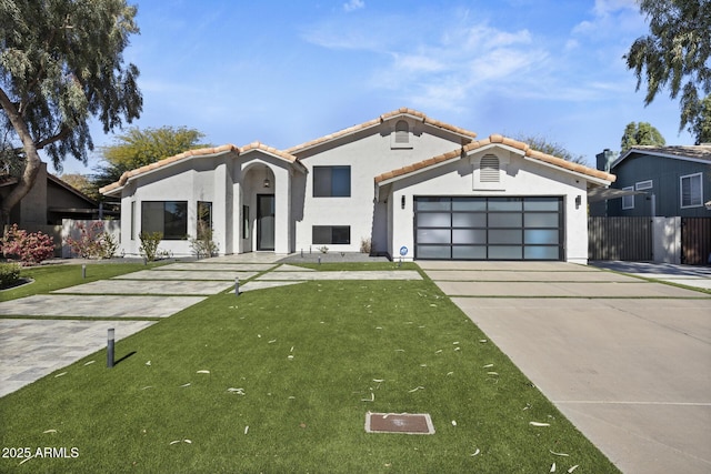 view of front of home with a garage and a front yard