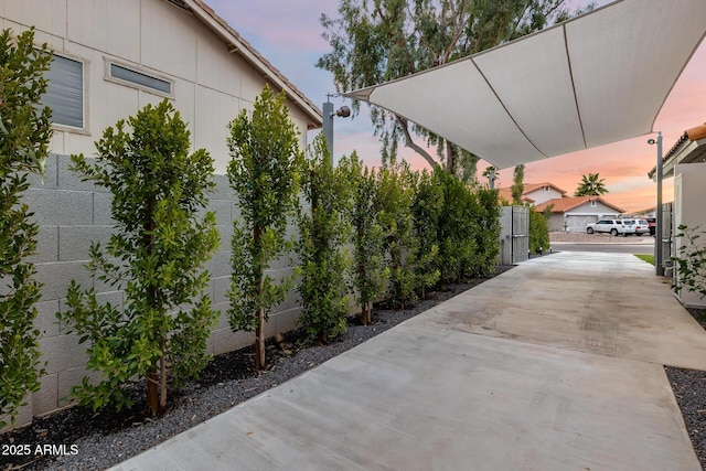 view of patio terrace at dusk