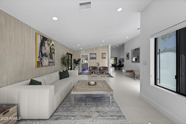 living room featuring lofted ceiling