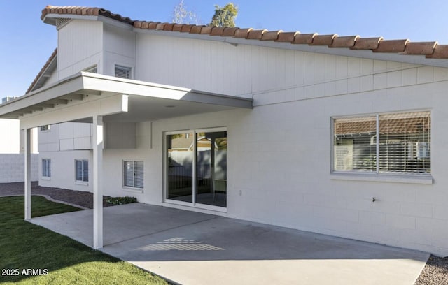 back of house with a patio