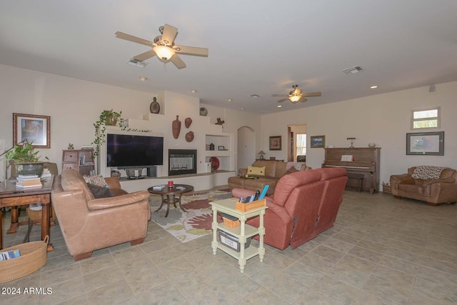 living room featuring ceiling fan and light tile floors