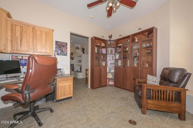 tiled office space with ceiling fan