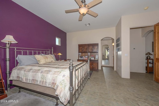 bedroom featuring tile floors and ceiling fan