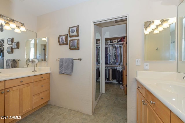 bathroom with tile flooring and vanity