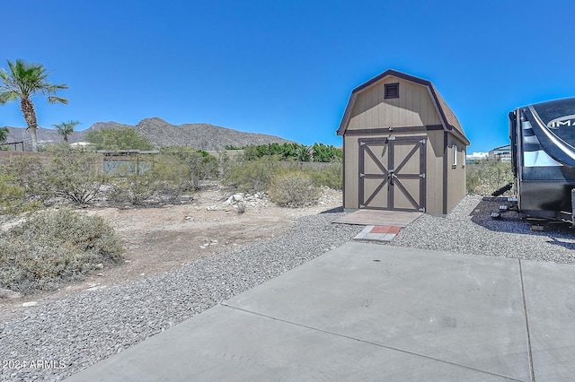 view of shed / structure with a mountain view