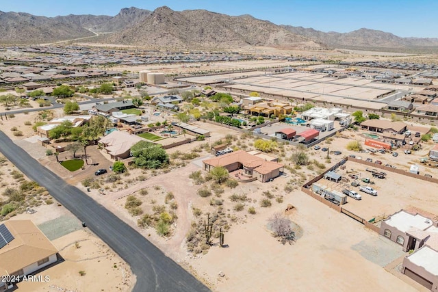 birds eye view of property with a mountain view