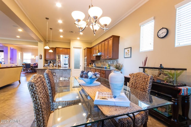 dining room with an inviting chandelier and crown molding