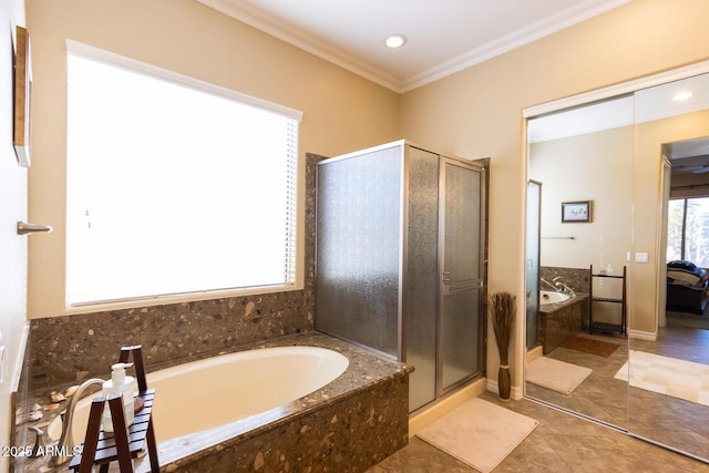 bathroom featuring tile patterned floors, ornamental molding, and separate shower and tub