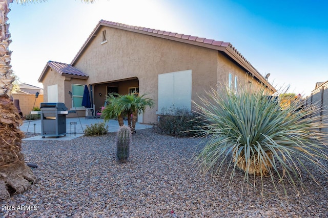 back of house featuring a patio