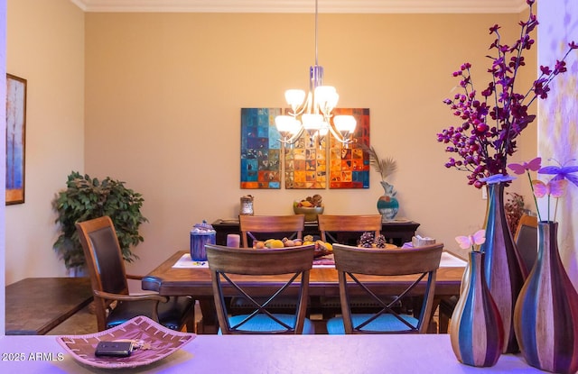 dining area featuring an inviting chandelier and crown molding