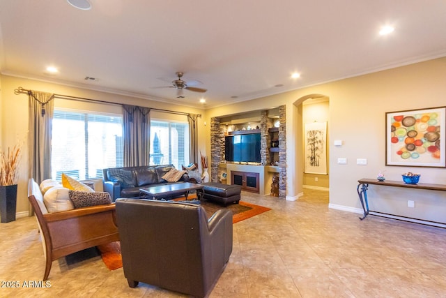 living room featuring ceiling fan and crown molding