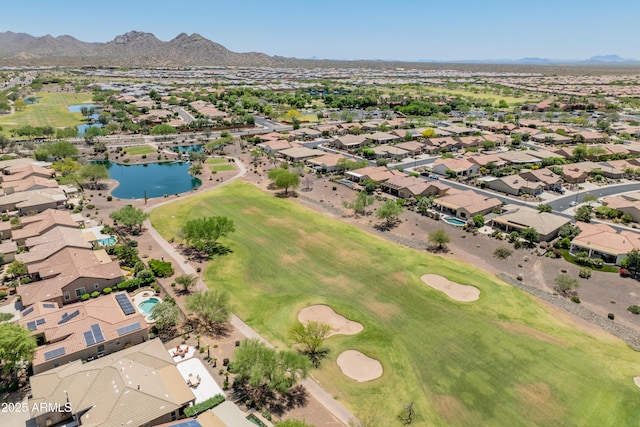 birds eye view of property featuring a water and mountain view